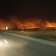 A Controlled fire burns a field in the middle of the night in rural Kansas.